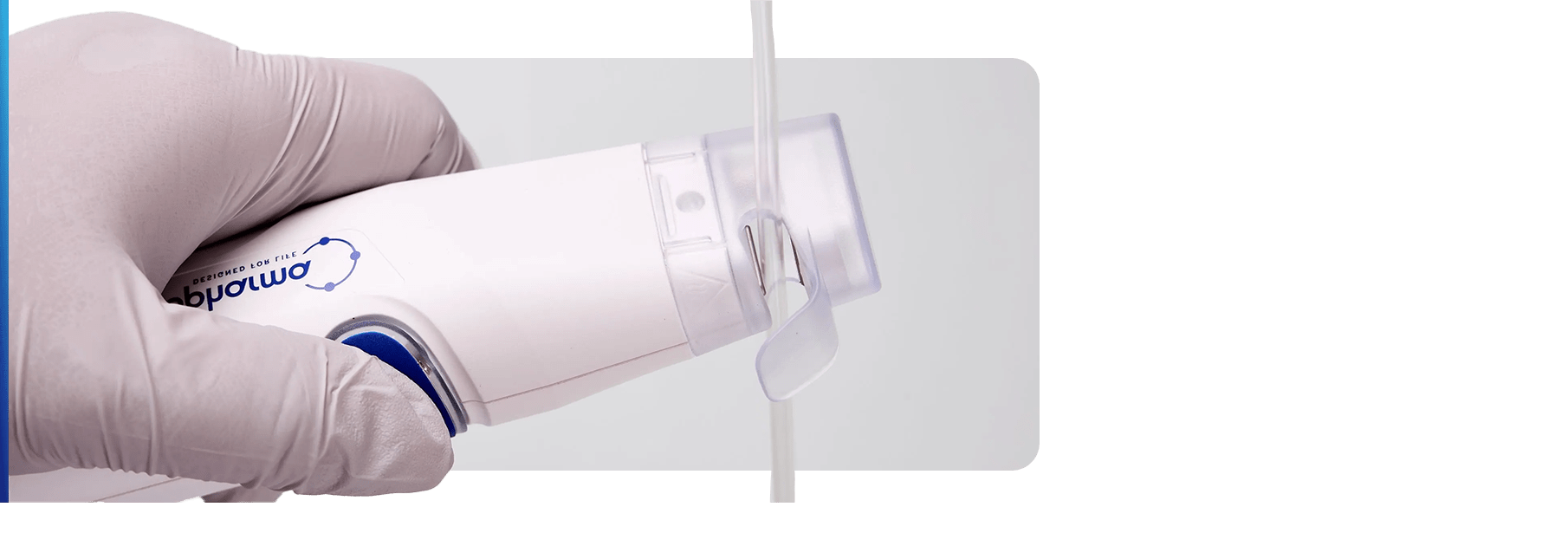 One hand holds the sealer ready to seal tubing.